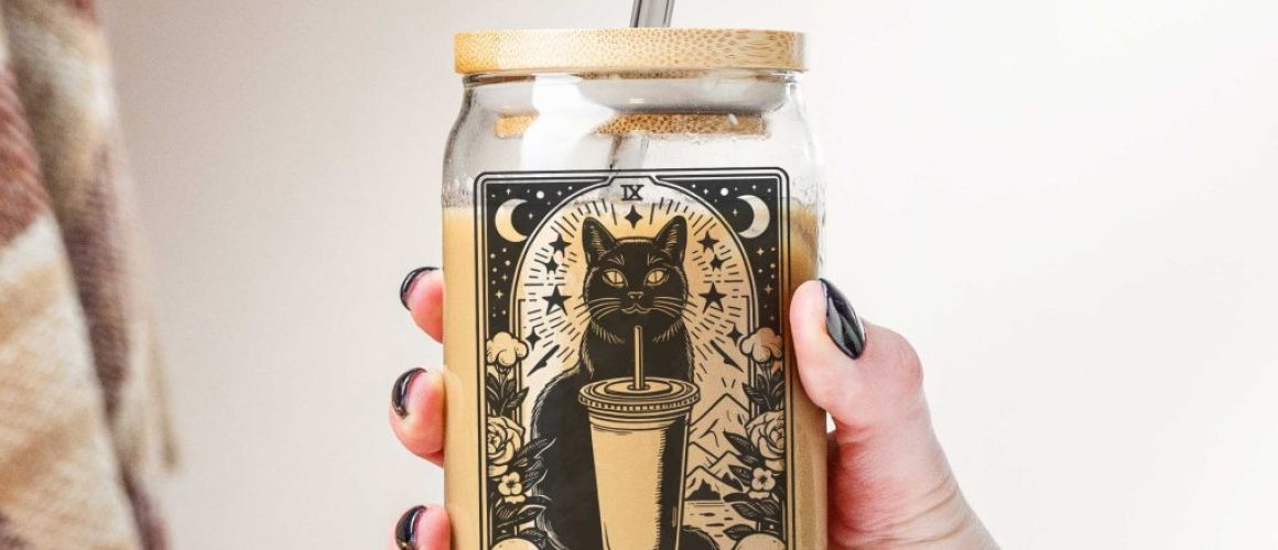 Hand-holding-glass-can-cr Witchy Tarot Cat Iced Coffee Glass Cup - 16oz Can Glass Tumbler With Lid & Straw, Cat Lover Astrology Gift
