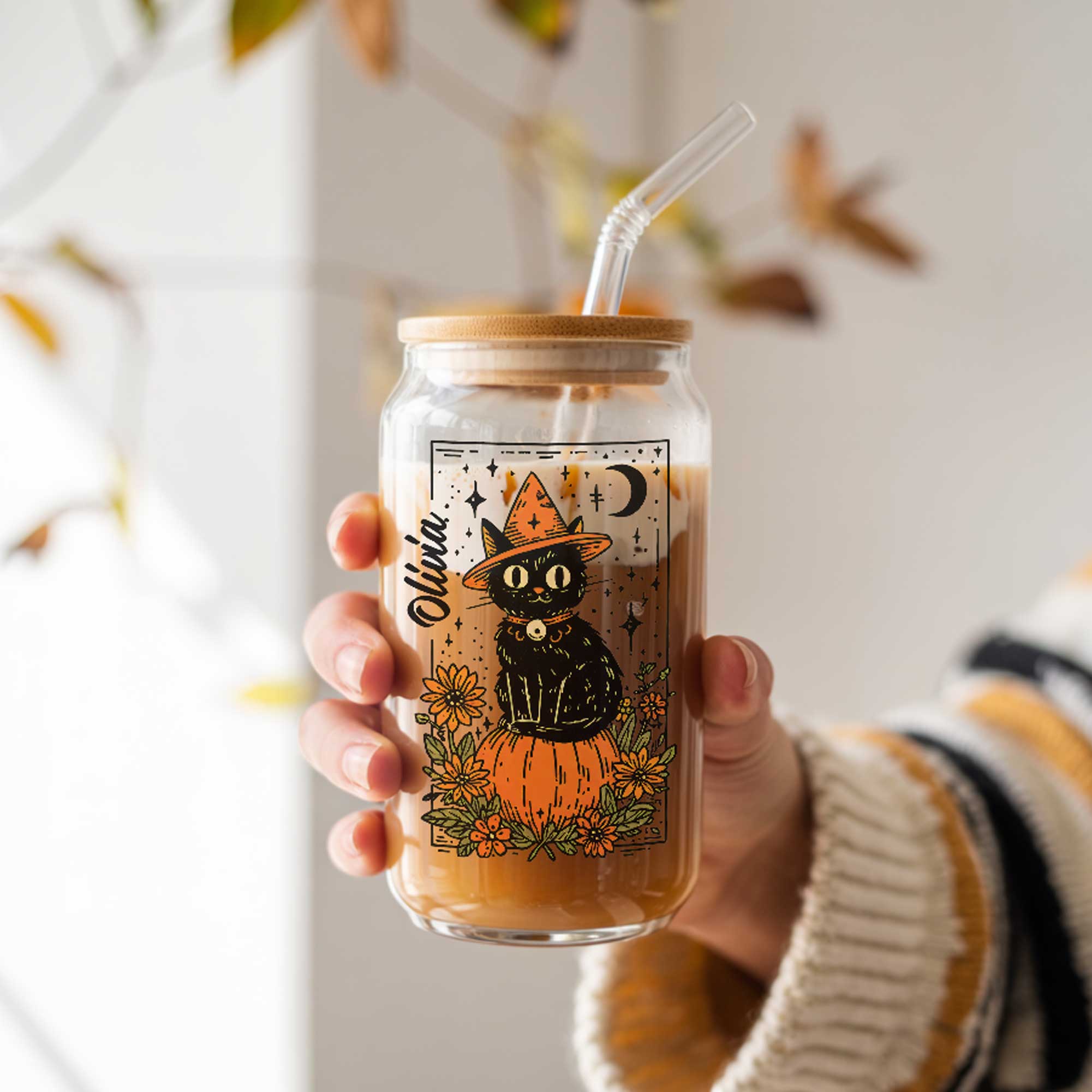 Personalized Halloween glass can with black cat on pumpkin, flowers and moon, name in script, bamboo lid and straw